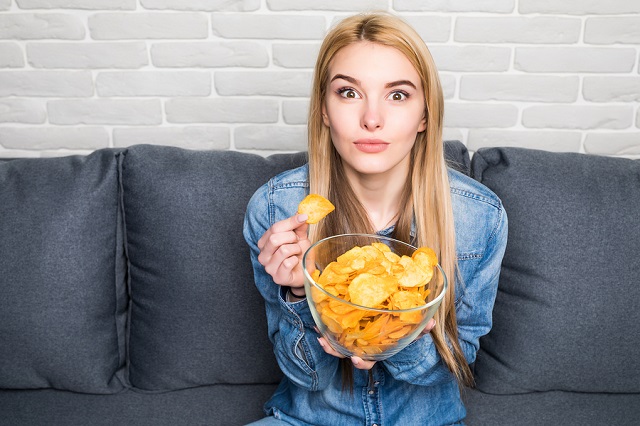 bigstock Portrait Of Smiling Girl Eatin 185739247