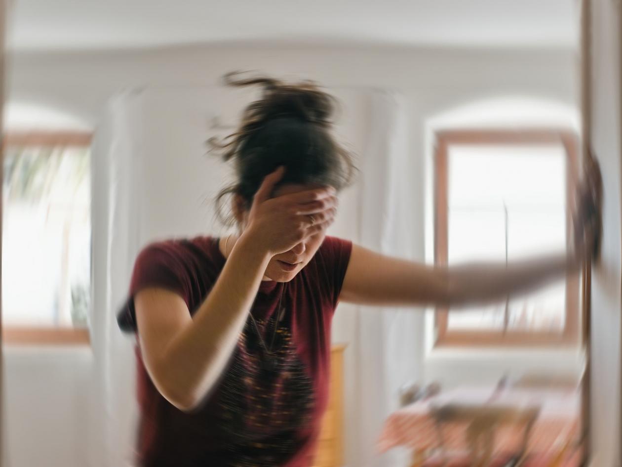 Blured Photo Of A Woman Suffering From Vertigo Or Dizziness Or Other Health Problem Of Brain Or Inne