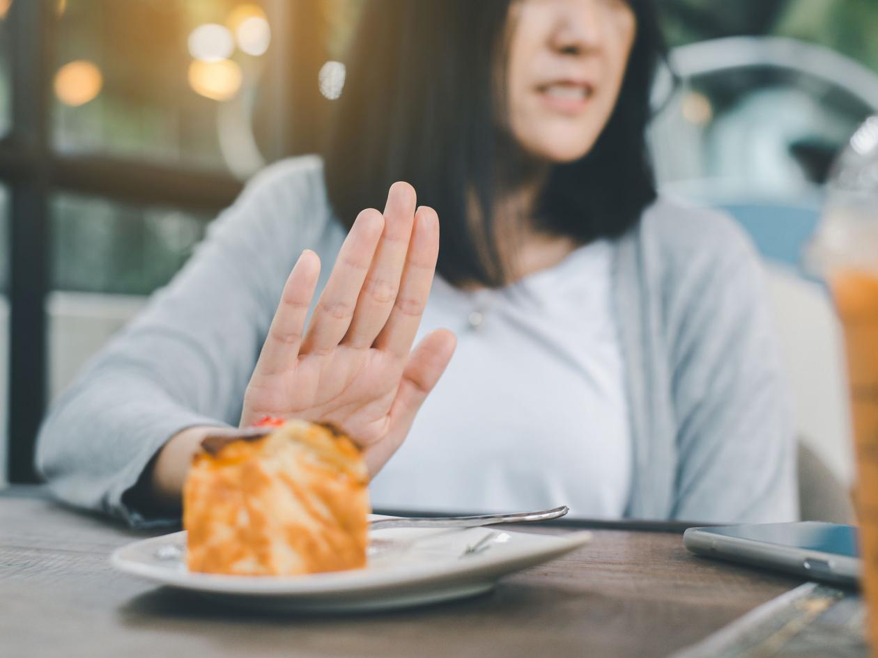 Hands Woman Refusing Cake Or Junk Food In Restaurant,no Meal,diet Food Concept