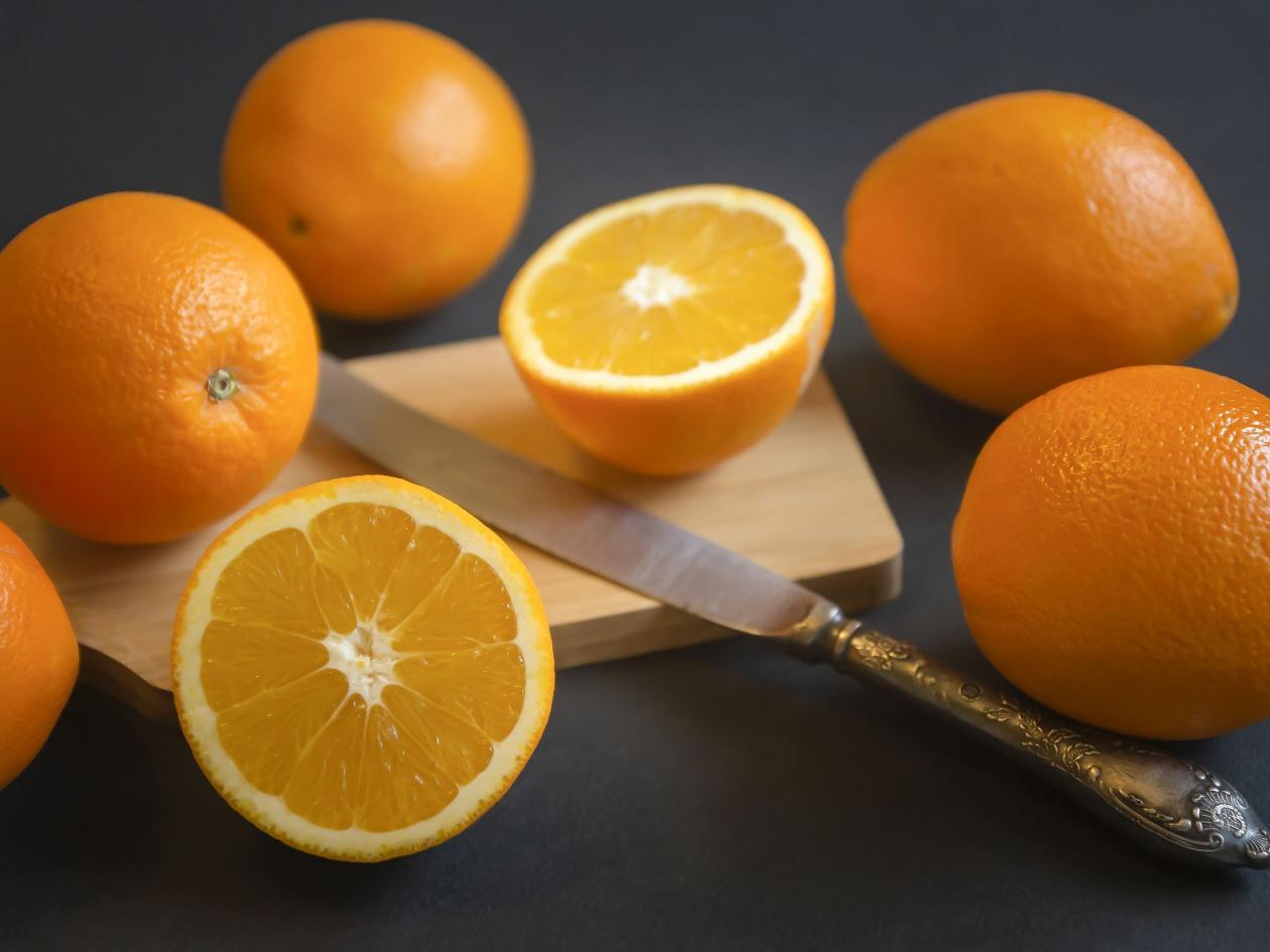 Orange Fruit With Green Leaves On The Wood. Home Gardening. Mandarine Oranges. Tangerine Oranges. Or