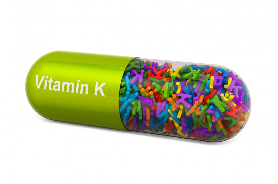 Vitamin K Capsule, Phylloquinone. 3d Rendering Isolated On White Background