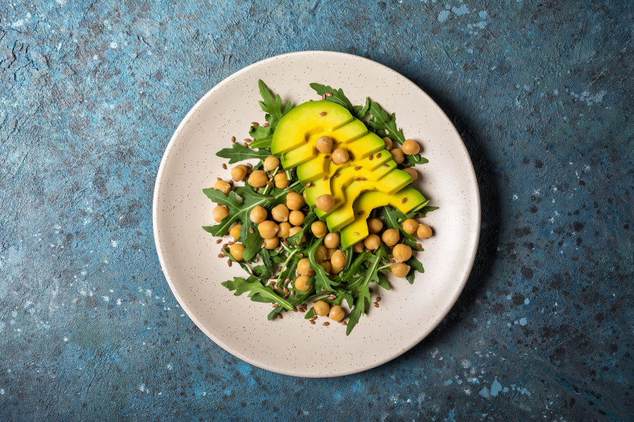 Healthy Vegetarian Food: Cooked Chickpeas With Fresh Arugula And Avocado