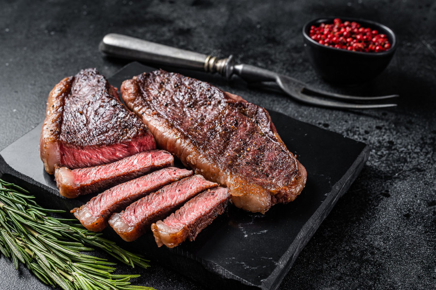 Grilled Top Sirloin Or Cup Rump Beef Meat Steak On Marble Board. Black Background. Top View